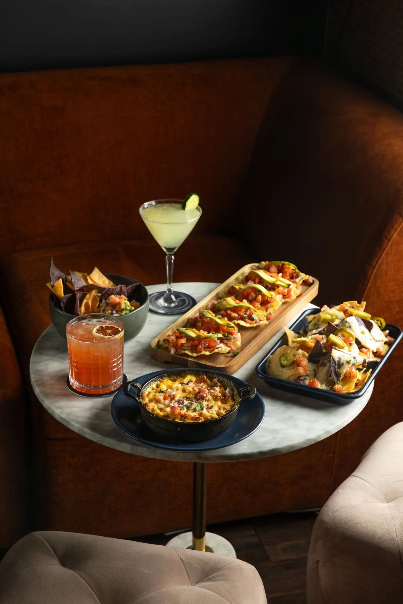 Drinks and shared plates set out on a table